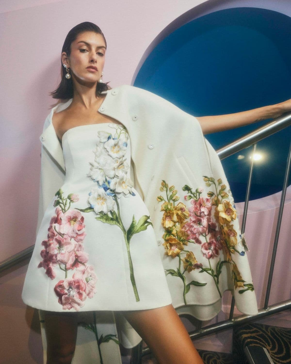 Editorial lifestyle photo of a model in Leo Lin womenswear, accompanying the 'Our Story' section