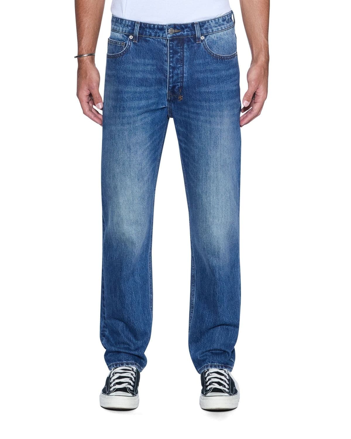 Model wearing Hazlow vintage blue wash denim jeans