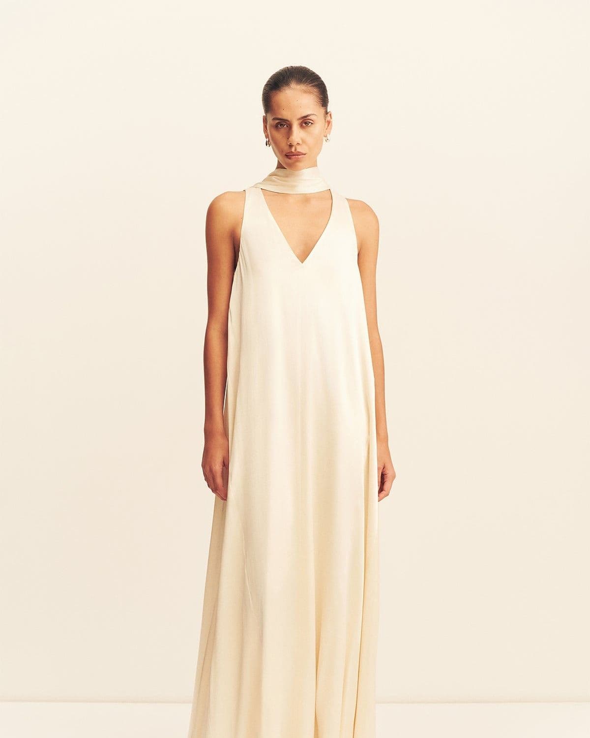 Model in the La Lune Scarf Panelled Maxi Dress (cream), front-facing full-length studio shot with draped satin scarf neckline