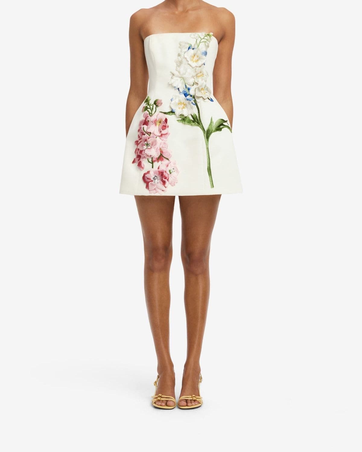 Model wearing the Roselle Embroidered Bustier Mini Dress in Snapdragon Print (Snow)